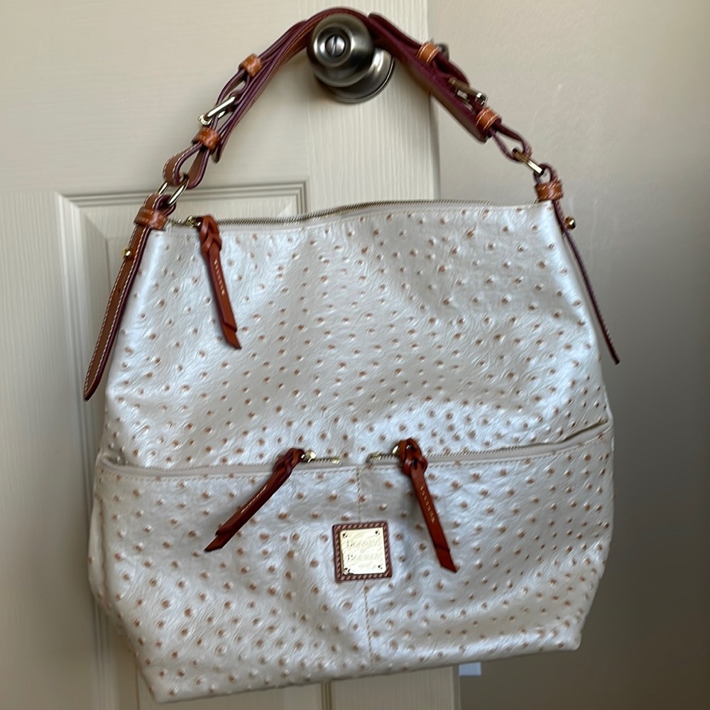 Dooney and Bourke pocket sack in ostrich emboss.